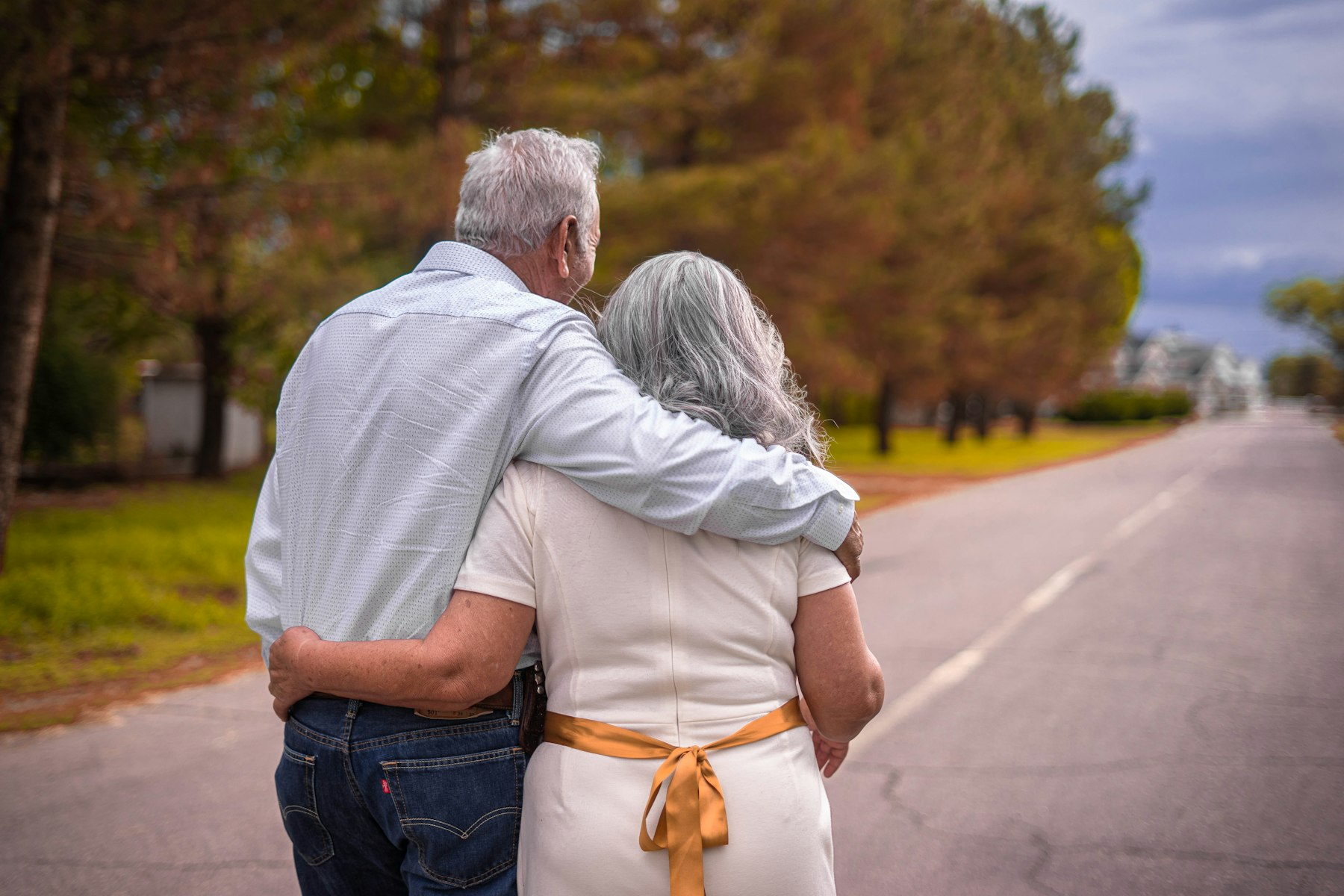 An older couple walking together