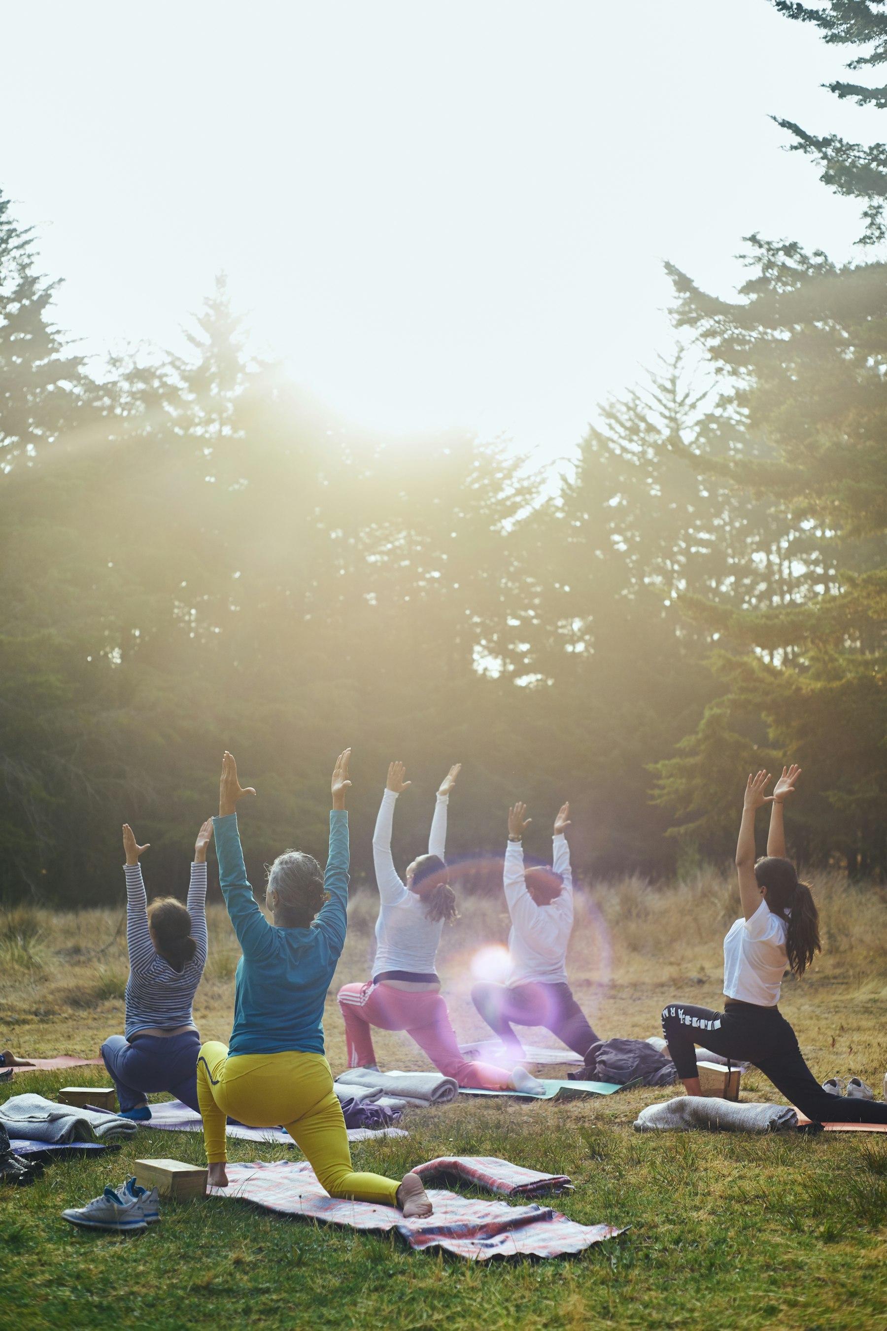 A group exercising outdoors in the sun