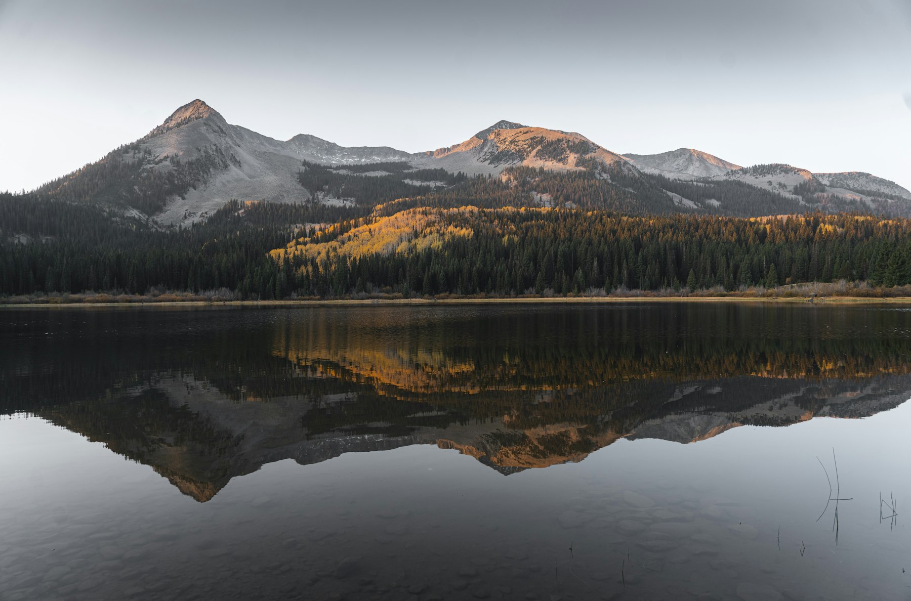 A mountain lake reflecting peaks